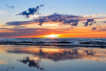 Fototapeta na wymiar Beautiful Sunset Over Baltic Sea with cloud and beams, Jurmala Dzintari