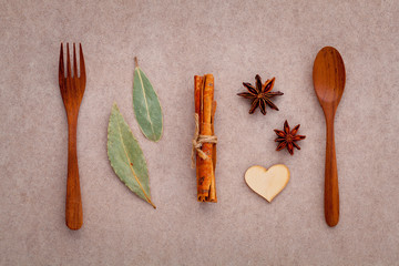 Wooden spoon and fork with cinnamon sticks ,star anise ,wooden h