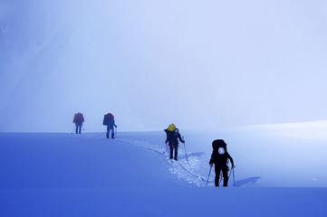 Alpinists traversing Mensu Glacier in Altai Mountains, Russian Federation