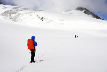 Alpinist traversing Mensu Glacier in Altai Mountains, Russian Federation