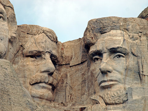 Sculpted images of Presidents Theodore Roosevelt and Abraham Lincoln at Mt. Rushmore National Memorial, Keystone, South Dakota, U.S.A.