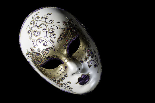 Venetian souvenir mask on black background isolated