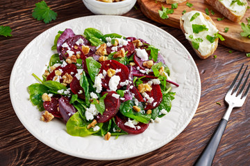 Healthy Beet Salad with fresh sweet baby spinach, kale lettuce, nuts, feta cheese and toast  melted 