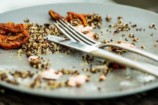 Food Left Overs On A Plate With A Knife And Fork