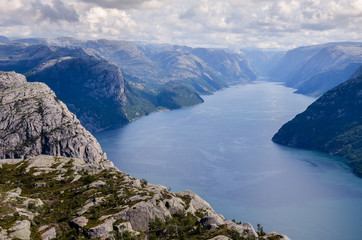 Naklejka na ściany i meble Lysefjorden from Preikestolen in Norway with the clouds in the sky