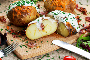 Hot Baked Potato with cheese, bacon, chives and sour cream. 
