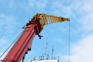 Yellow crane. Telecommunication antennas in a building.