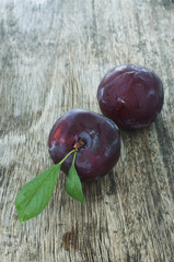 plums on a wooden table