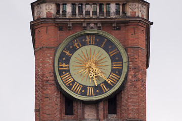 Medieval clock tower on a building in Europe 