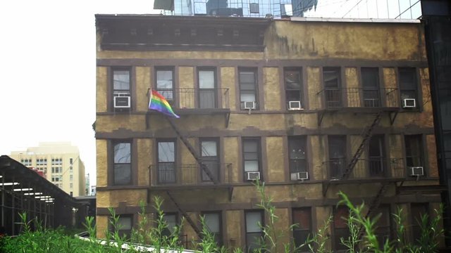 New York City, June 27th, 2016: Rainbow flag on a building near the famous New York Highline, one day after the LGBT pride fest on 26th June 2016.