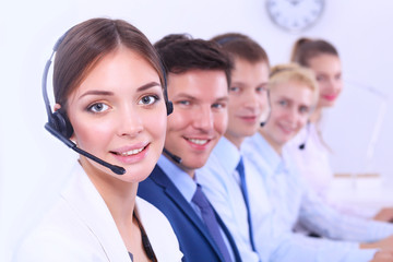 Smiling positive young businesspeople and colleagues in a call center office