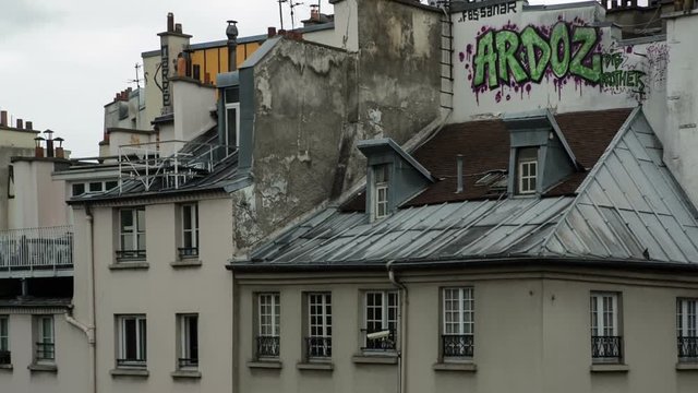 panning shot over paris rooftops