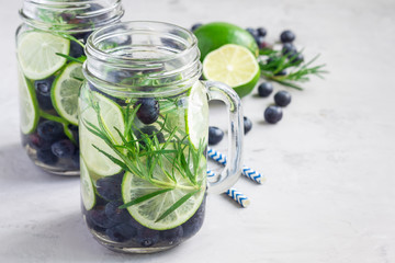 Infused water with fresh blueberry, lime and rosemary, copy space