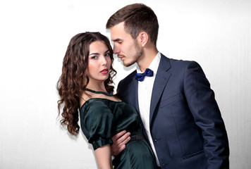 Elegant couple on light background