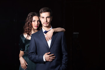 Elegant couple on dark background