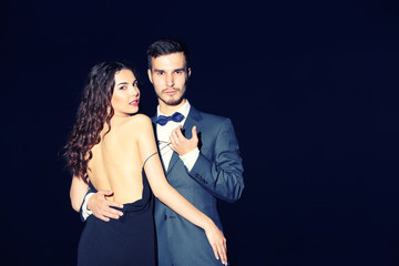 Elegant couple on dark background