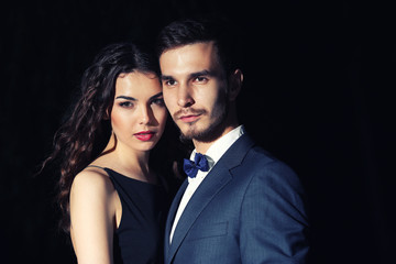 Elegant couple on dark background