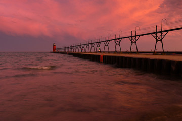 Fototapeta na wymiar Colorful sunrise sky with lighthouse