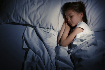 Cute sleeping girl in bed