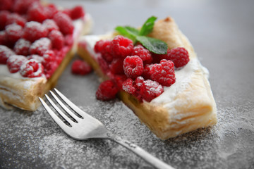 Fresh berry dessert on grey background