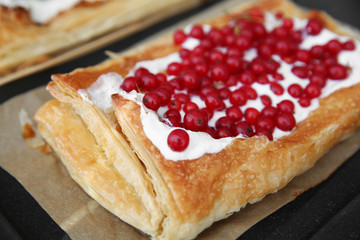 Fresh berry dessert on baking paper, closeup