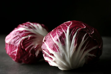 Obraz premium Fresh red cabbage on black background
