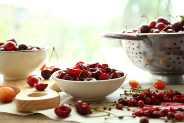 Heap of cherries on kitchen table