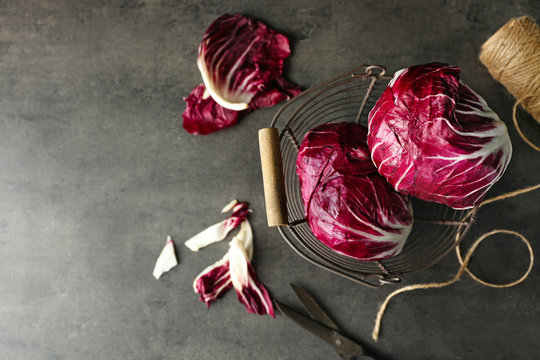 Fresh red cabbage on grey background, top view