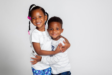 Young African American Siblings Hugging