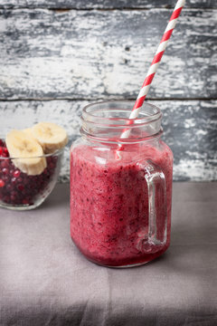 cranberry banana smoothie in  jar