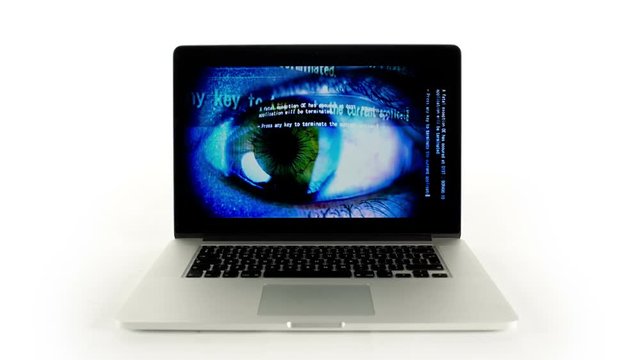 laptop computer with technology screensaver playing