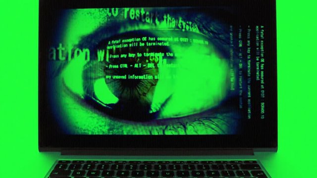 laptop computer with technology screensaver playing