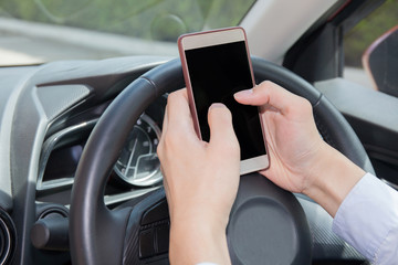 Businessman texting, chatting, playing on phone while careless driving