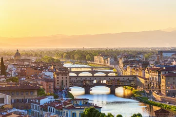 Foto auf Acrylglas Ponte Vecchio Blick auf Florenz bei Sonnenuntergang mit der Brücke Ponte Vecchio und dem Arno