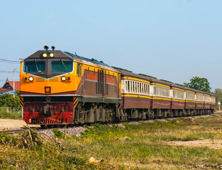 Fototapeta na wymiar Passenger train was passing through rural area, 2016.