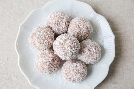 Homemade Strawberry, Date, Cashew And Coconut Bliss Ball On Vint