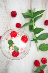 Ice cream with berries on wooden background