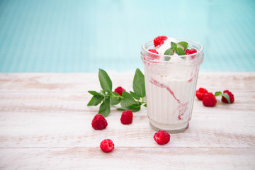 Ice cream with berries on wooden background