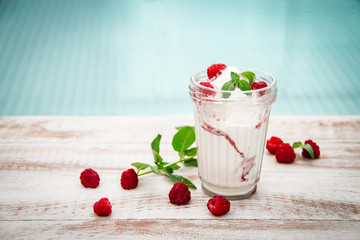 Ice cream with berries on wooden background