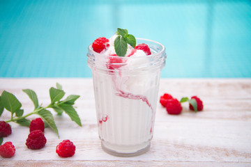 Ice cream with berries on wooden background