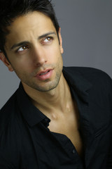 Obraz premium Portrait of an handsome male wearing a black shirt