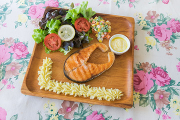 Grilled Salmon steak with salad.