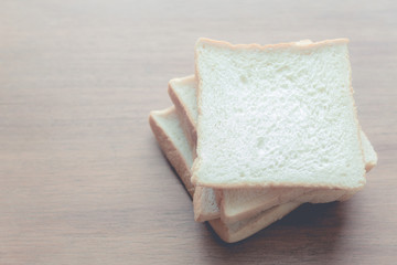 slice of bread on wooden table background