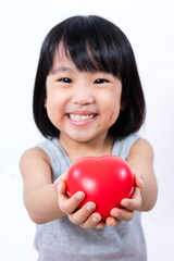 Fototapeta na wymiar Asian Little Chinese Girl Holding Red Heart
