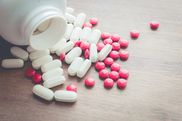 medicine pill on wood table