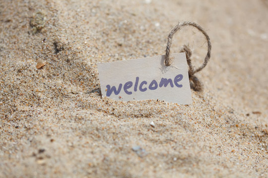 Message Welcome on the sand