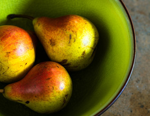 Ripe pear on stone table