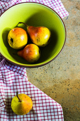 Ripe pear on stone table