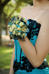 Pretty turquoise and black wrist corsage worn to the prom.
