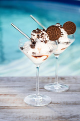 Vanilla sundae ice cream with sauce and cookie